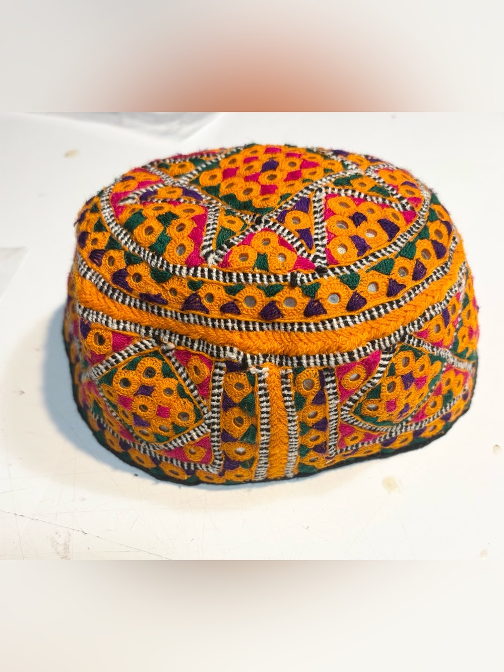 traditional handmade Balochi or Bugti cap featuring vibrant yellow embroidery